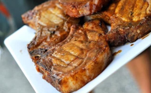 Grilled pork chops glazed with sweet mustard barbecue sauce